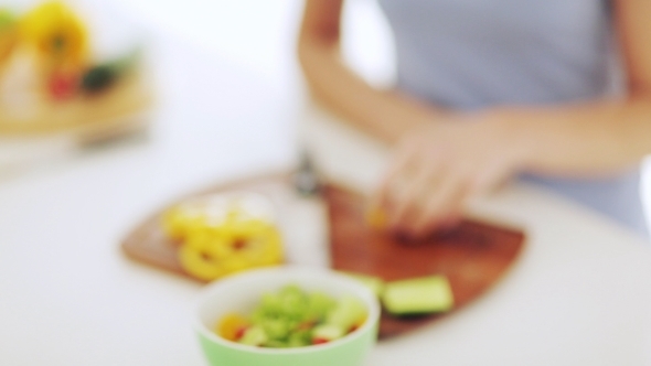 Woman Chopping Vegetables At Home