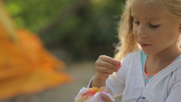 Beautiful Little Girl With Pierced Ears Eats