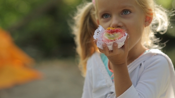 Amazing Little Girl With Blue Eyes Eating Cake