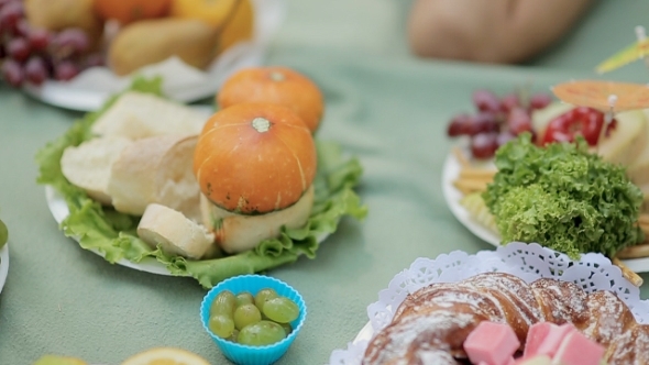 Fruits, Greens And Bakery On Picnic In The Forest