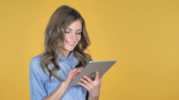 Young Girl Browsing Internet Using Tablet