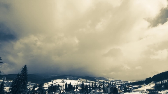 Clouds Moving Over The Top Of The Mountain