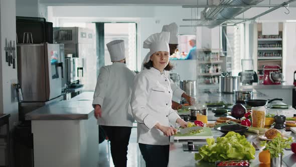 Portrait of Female Chef Working in Authentic Kitchen