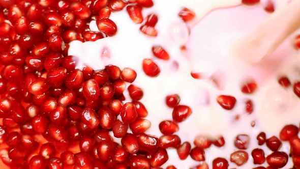 Milk Flow Fills Pomegranate Seeds