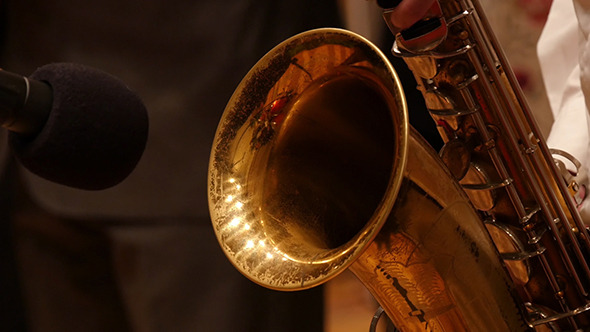 Guy Playing The Saxophone Gold alt