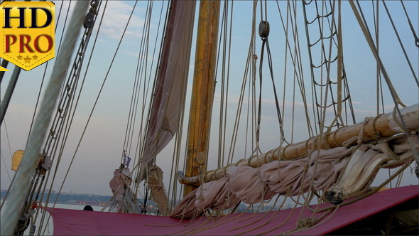 Ropes and Rolled Big Clothes on the Sail Mast