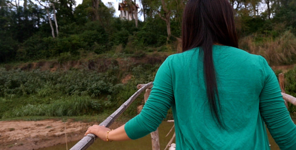 Girl Walking On Bamboo Bridge