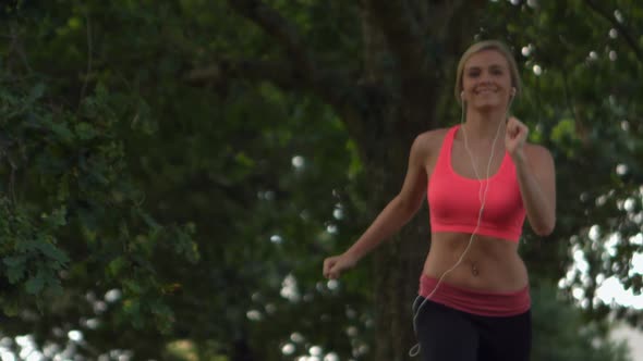 Happy Toned Blonde Running In Park