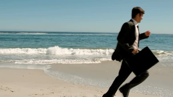 Businessman Running On The Beach alt