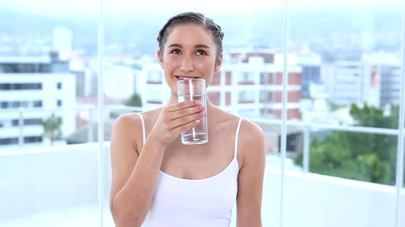 Happy Young Woman Drinking Water