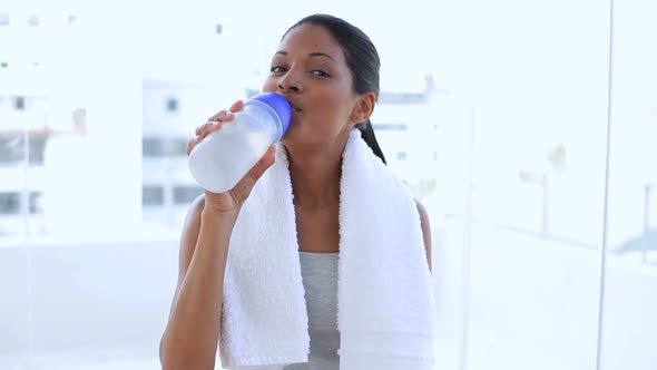 Beautiful Woman With Towel Drinking Water On Her Flask alt