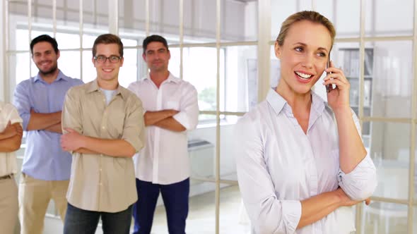 Smiling Businesswoman Phoning alt