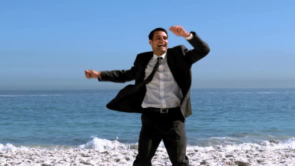 Free Happy Businessman Dancing On The Beach alt