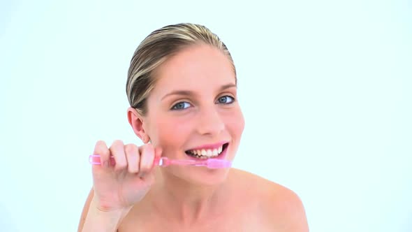 Blond Woman Brushing Her Teeth
