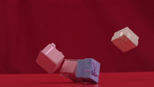 Presents Falling And Dropping On Red Background alt