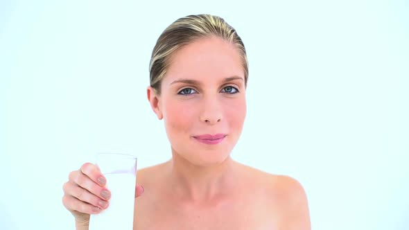 Smiling Woman Drinking A Glass Of Milk alt
