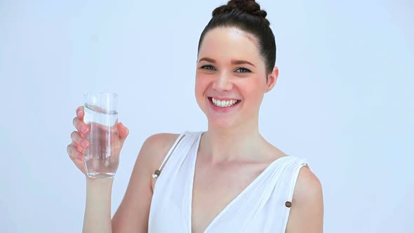 Smiling Woman Drinking A Glass Of Water