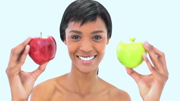 Smiling Woman Holding Two Apples