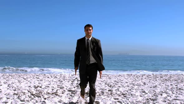 Businessman Walking On The Beach Like A Robot