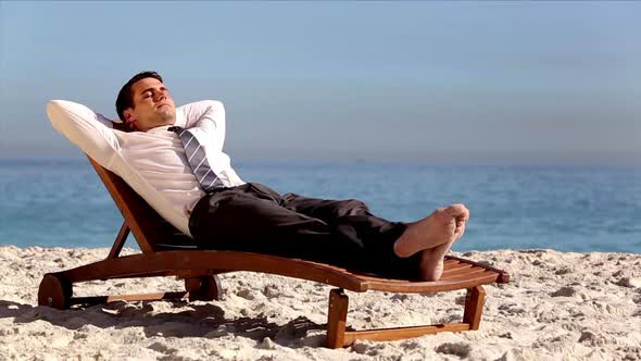 Unstressed Businessman Relaxing On The Beach