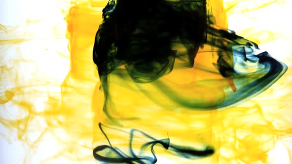 Yellow Ink Swirling Into Water Whirlpool alt