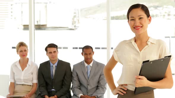 Businesswoman Giving Thumbs To Camera