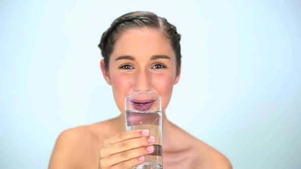 Smiling Young Woman Drinking Water 1