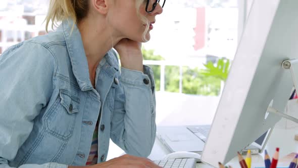 Blonde Young Designer Working At The Desk