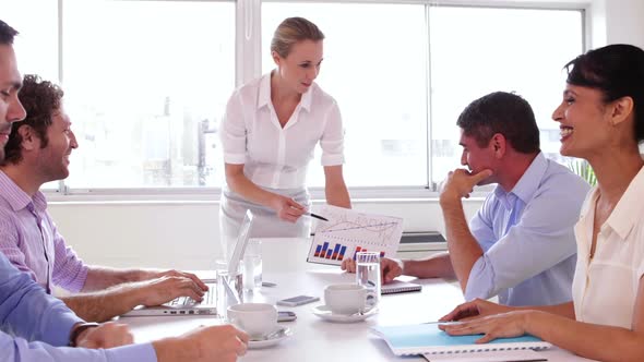 Businesswoman Talking To Her Colleague During A Presentation