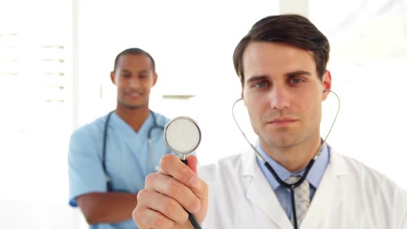 Doctor Holding Up His Stethoscope alt