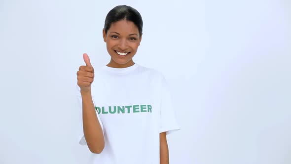 Volunteer Woman Smiling And Does A Thumb Up At Camera