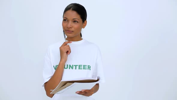Volunteer Woman Thinking And Writting On Notebook