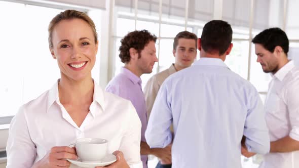 Cheerful Businesswoman Holding A Cup