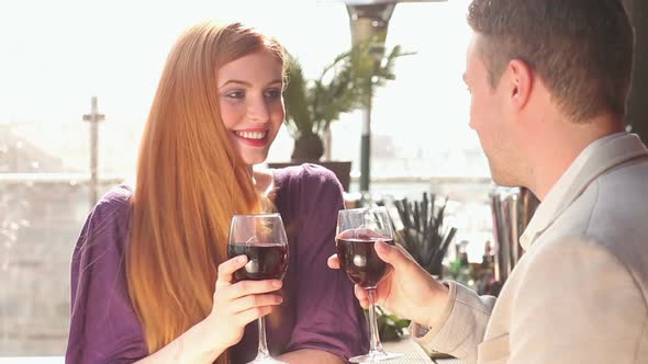 Loving Couple Talking While Having Glass Of Red Wine alt