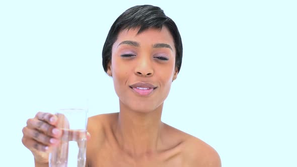 Radiant Woman Drinking A Glass Of Water