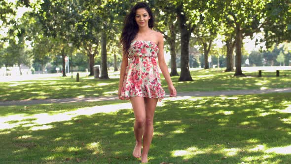 Gorgeous Happy Brunette Walking In Park