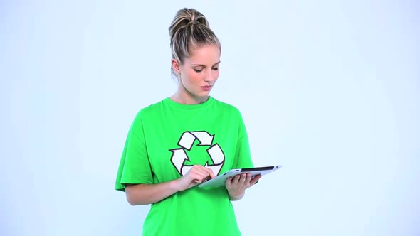 Doubtful Environmental Activist Using A Digital Tablet alt