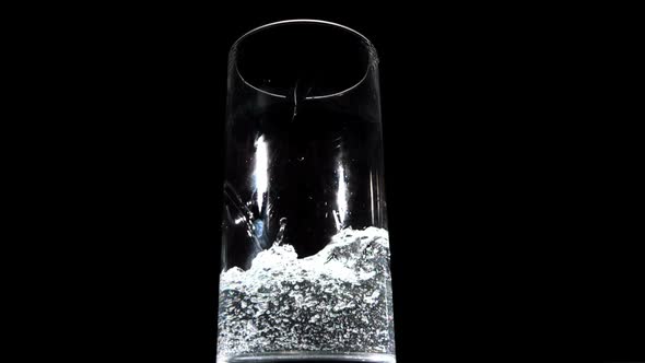 Water Being Poured On Black Background