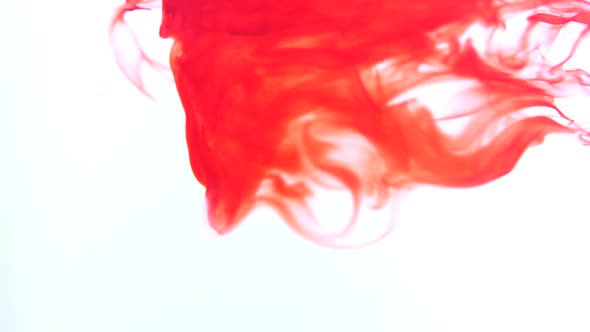 Red Ink Swirling In Water