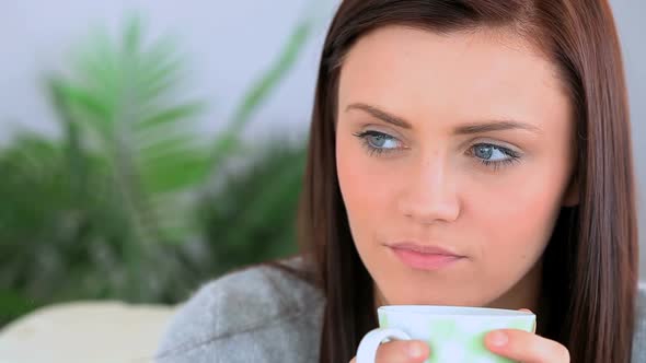 Brunette Woman Holding A Cup Of Coffee alt
