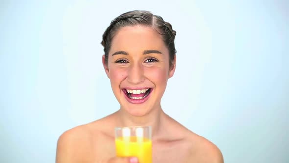 Young Woman Drinking Orange Juice 2