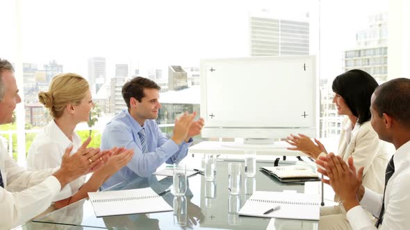 Business People Applauding At A Meeting