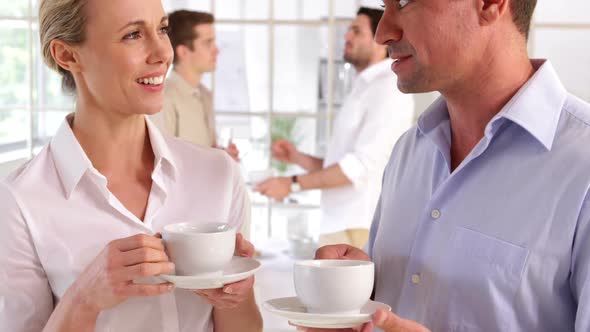 Attractive Colleagues Chatting While Having A Break