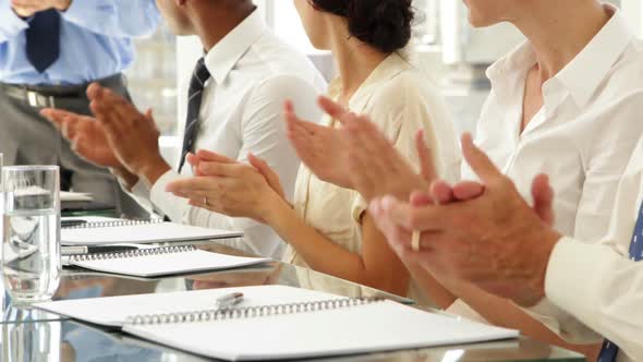 Business People Clapping At Presentation