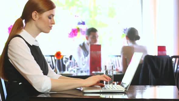 Serious Businesswoman Working On Her Laptop alt