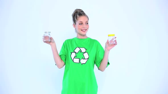 Attractive Environmental Activist Holding Two Bottles