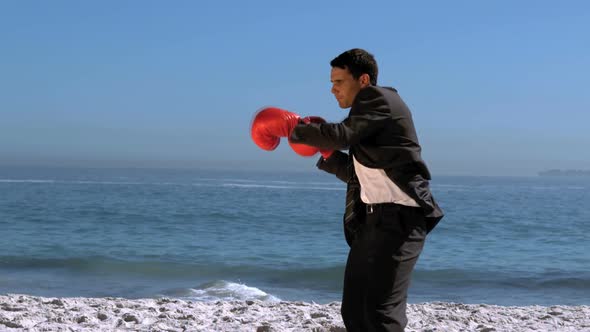 Handsome Businessman Boxing On The Beach