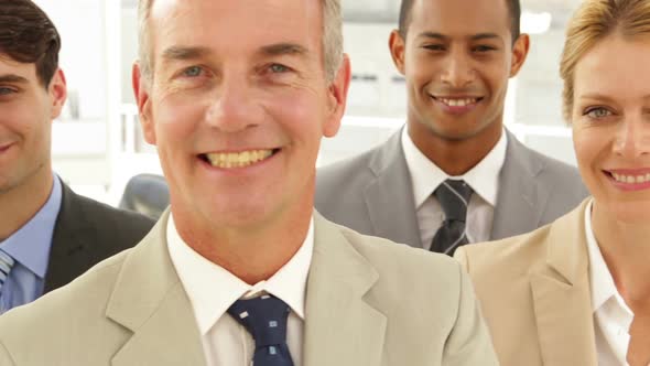Business People Smiling Up To Camera alt