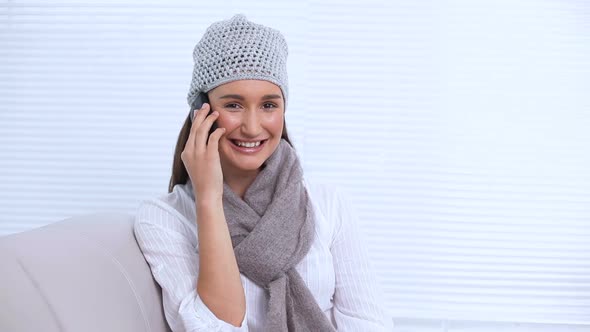 Young Woman With Hat And Scarf Calling Someone