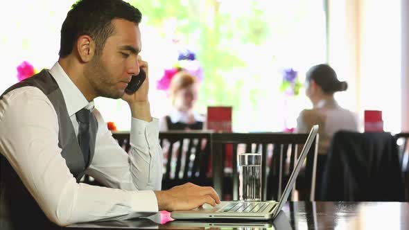 Handsome Businessman Working On His Laptop